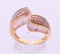 An 18 ct gold rose quartz and diamond dress ring marked 
