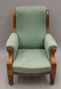 A Victorian green upholstered walnut armchair. 72 cm wide.