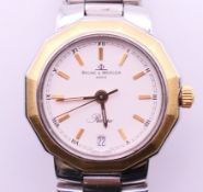A Baume and Mercier Riviera 5231.038 quartz ladies wristwatch with white dial. 2.5 cm diameter.