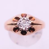 A 9 ct gold gentleman's rose gold diamond gypsy set ring. Ring size R/S.