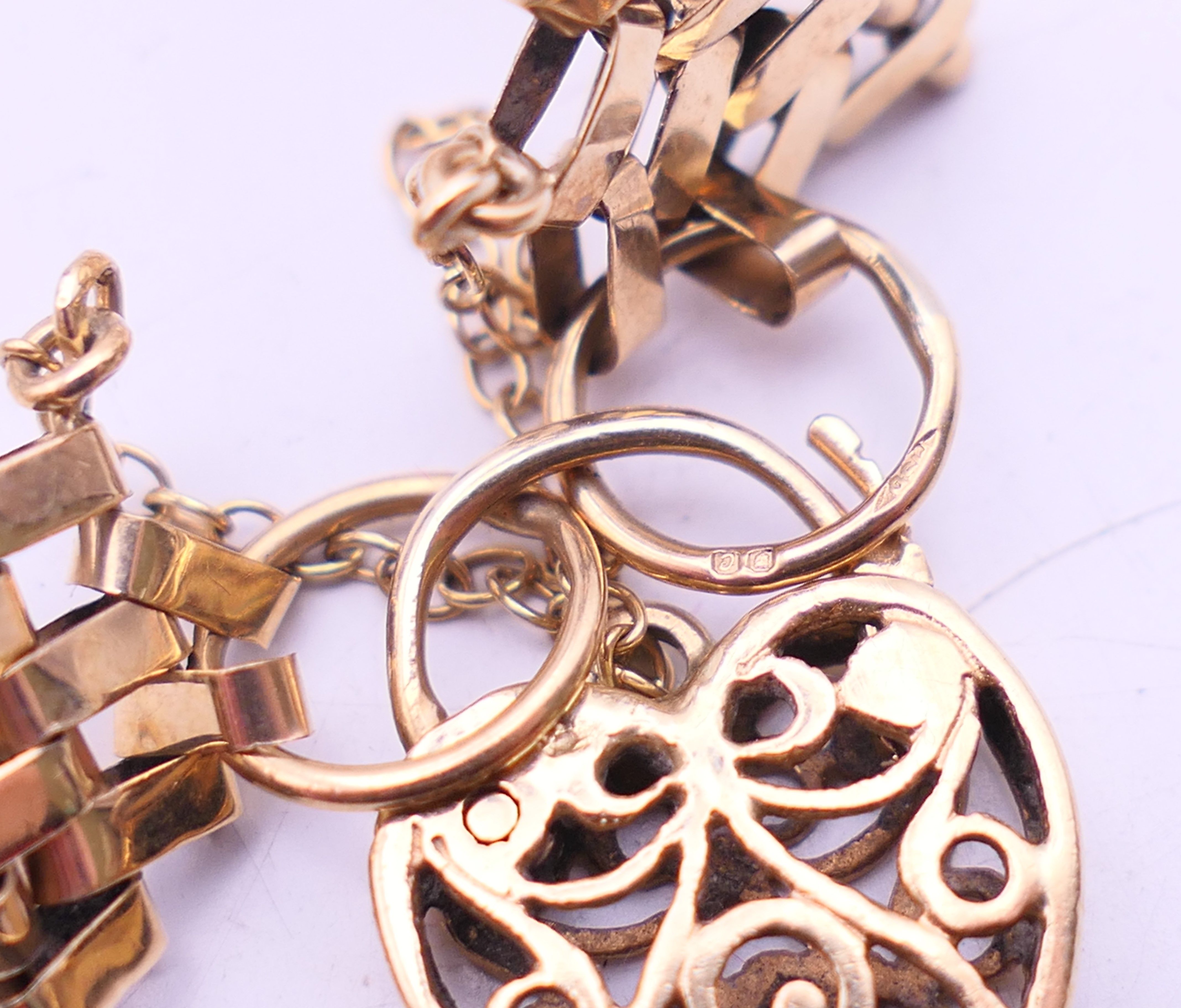A 9 ct gold gate link bracelet with heart padlock. 18 cm long. 12. - Image 3 of 9