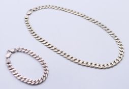 A gentleman's silver curb link chain and silver curb link bracelet.