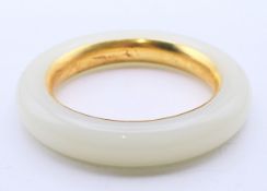 A white jade bangle. 6 cm inner diameter.