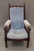 A Victorian bobbin twist open armchair. 65 cm wide.