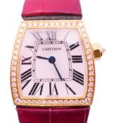 A boxed diamond set 18 ct gold Cartier La Dona de Cartier wristwatch,