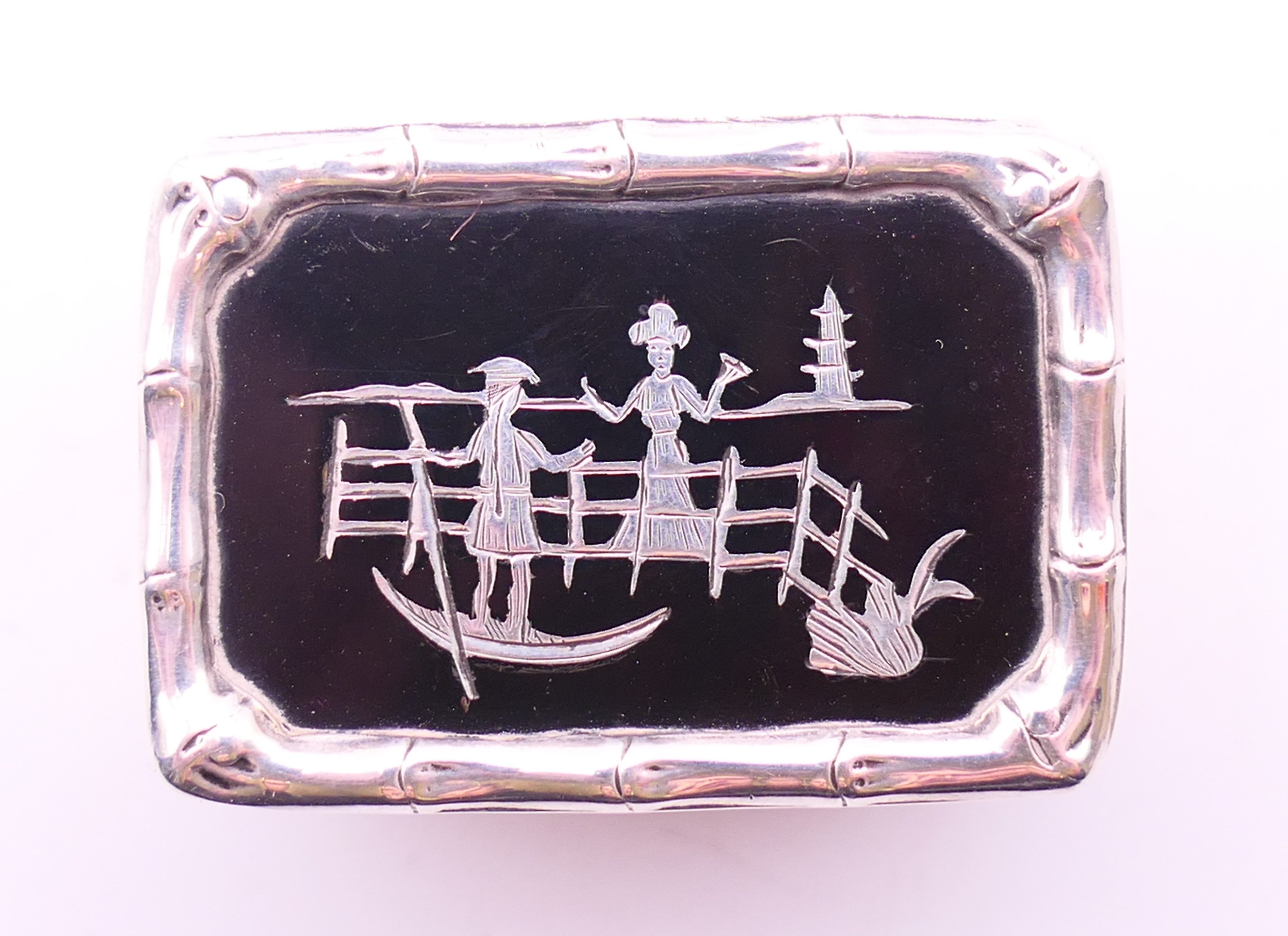 An Edwardian silver pill box, the lid with inlaid silver design on tortoiseshell, - Image 2 of 4