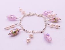 A silver, Murano glass and pearl bracelet. 20 cm long.