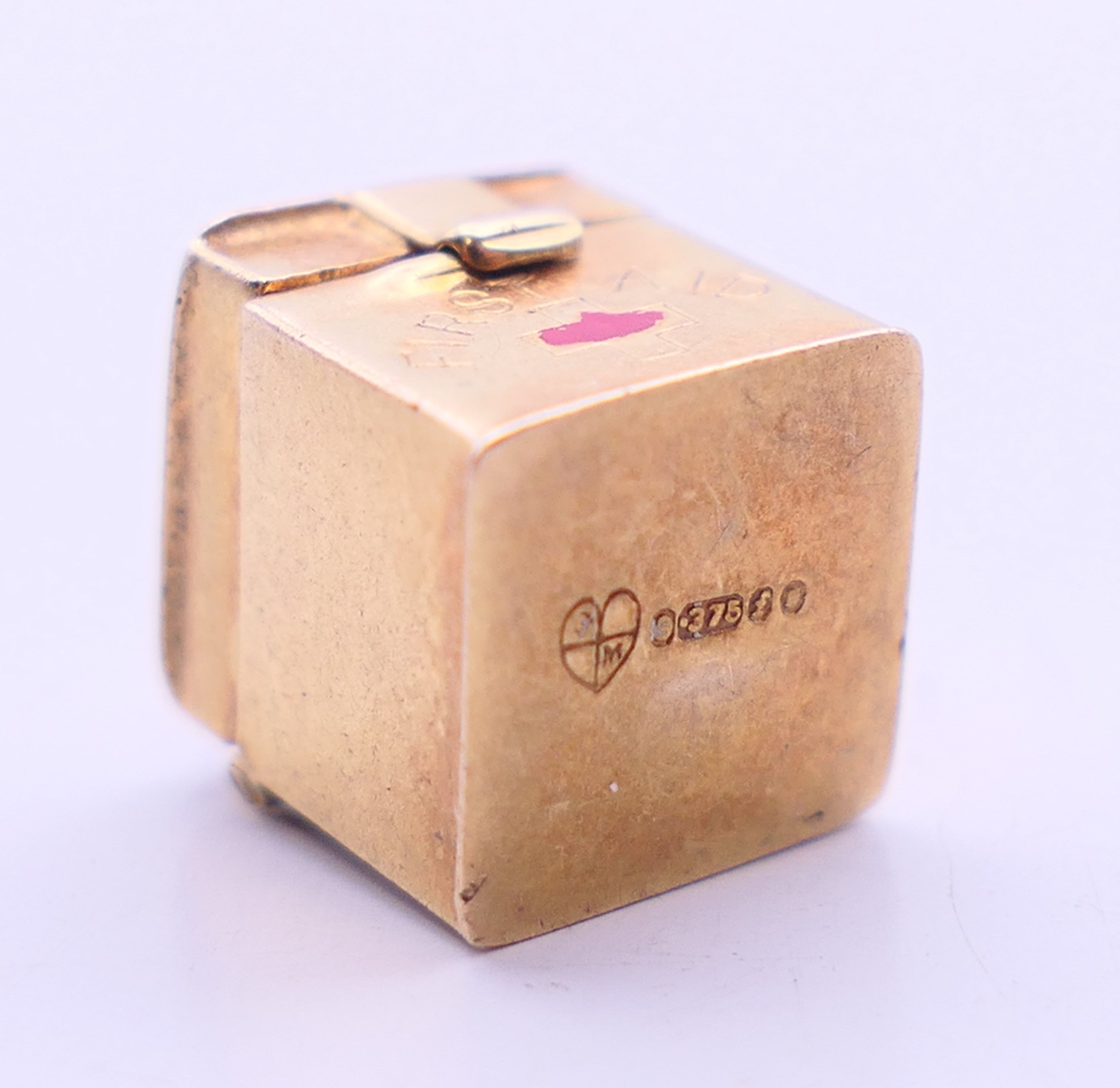 Three 9 ct gold charms to include: a 'first aid' box, - Image 14 of 14
