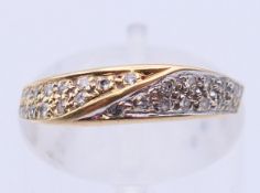 A 14 ct gold and diamond ring. Ring size L.