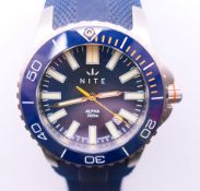 A boxed Nite Alpha gentleman's wristwatch. 4.75 cm wide.