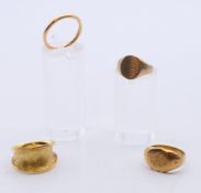 A 22 ct gold wedding band 2.9 grammes, an 18 ct gold signet ring 5.