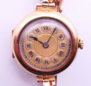 A 9 ct gold ladies wristwatch, the case marked 9 ct and numbered 16504,