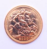 An uncirculated 2000 Queen Elizabeth gold half sovereign.