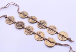 A quantity of Chinese coins. each 2.5 cm diameter.
