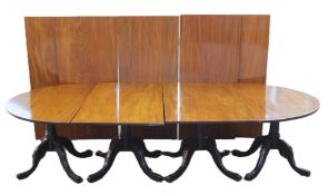 A reproduction four pillar dining table with five additional leaves. 624.5 x 152 cm.