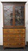 A 19th century mahogany secretaire with associated bookcase top. 125 cm wide and 226 cm high.
