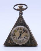 A brass Masonic type pocket watch. 6 cm high.