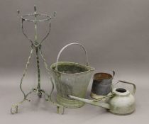 A galvanized bucket, jug and watering can together with a plant stand. The watering can 69 cm long.