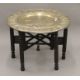 An Eastern brass-topped folding table. 75 cm diameter. - Image 1 of 5