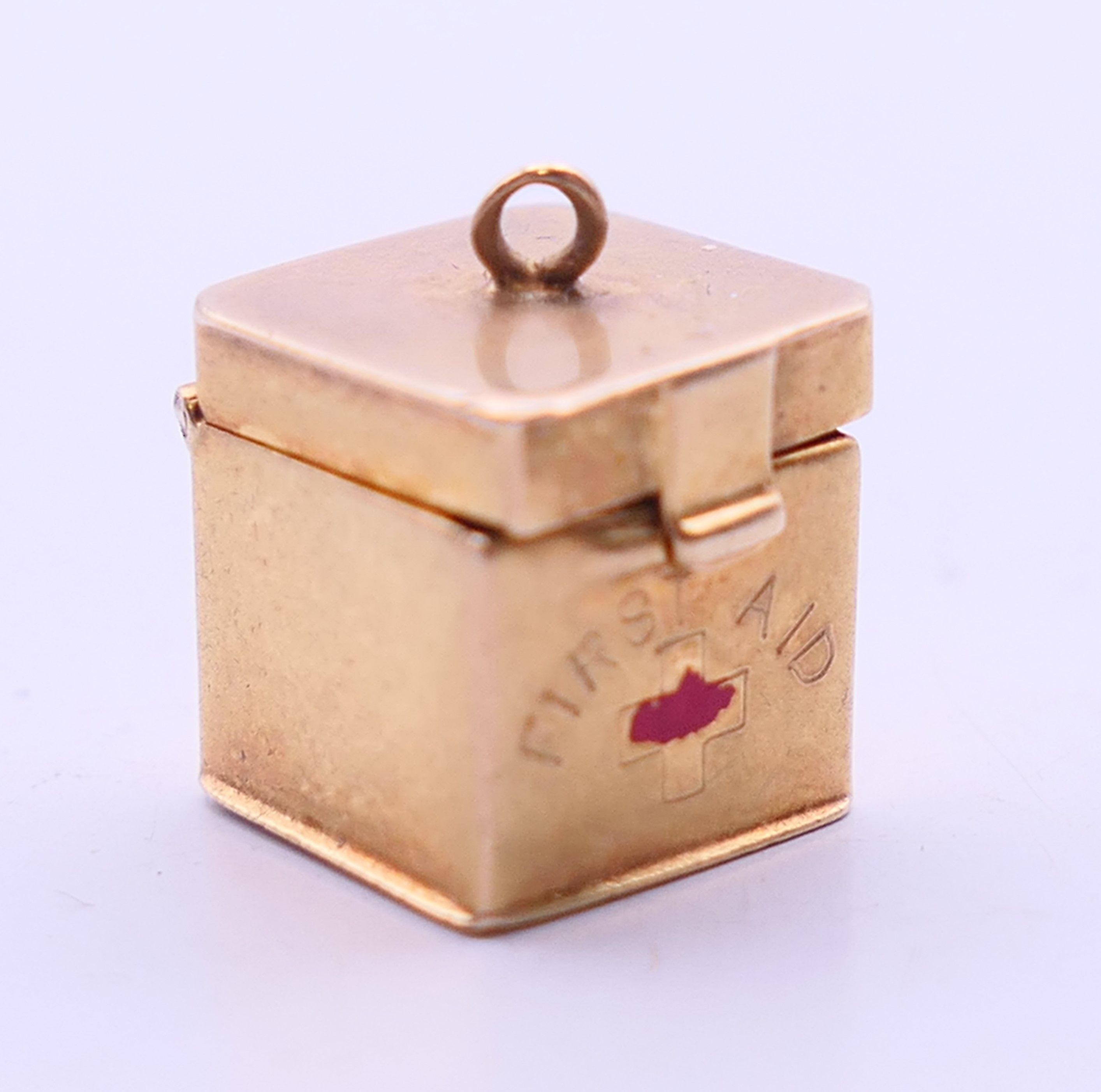 Three 9 ct gold charms to include: a 'first aid' box, - Image 11 of 14