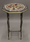 A cast iron table with specimen stone top. 54 cm wide.