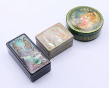 Three Russian boxes. The largest 7 cm long.