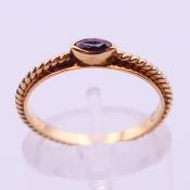 A 14 ct gold ruby ring. Ring size L.