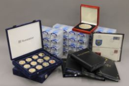 A large collection of boxed world and commemorative coins.