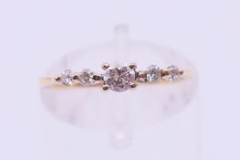 An 18 ct gold five-stone diamond ring. Ring size J.
