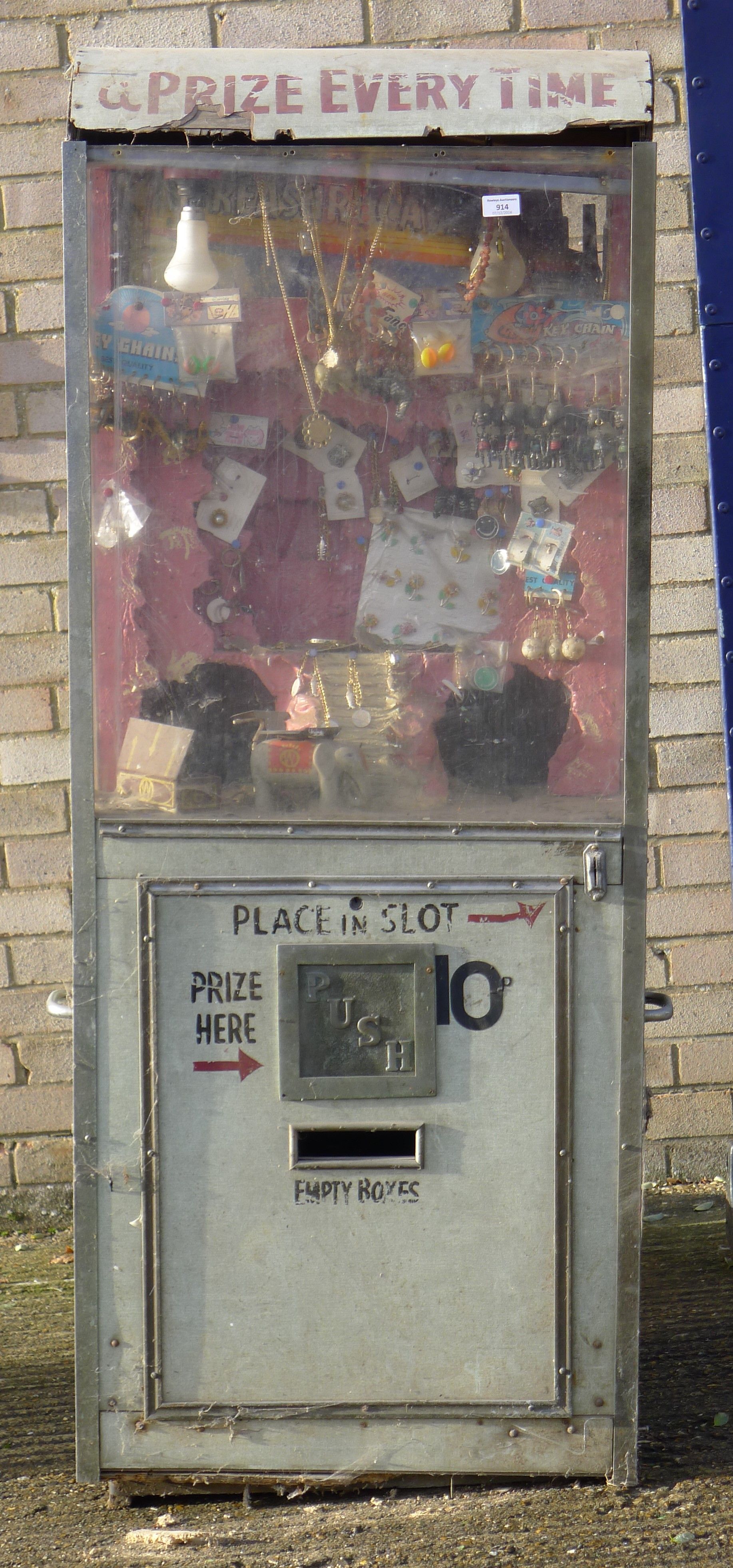 A vintage fairground prize machine. 62 cm wide and 160 cm high.