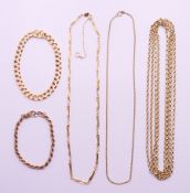 Three 9 ct gold chains, a 9 ct gold rope twist bracelet and a 14 ct gold curb link bracelet.