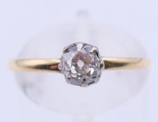 An unmarked 18 ct gold diamond solitaire ring the rose cut stone approximately 0.5 ct. Ring size M.