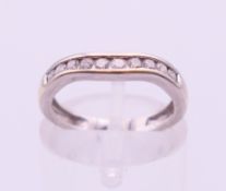 A 9 ct white gold diamond channel set ring. Ring size H/I.