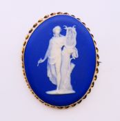 A Wedgwood cameo oval brooch. 7 cm high.