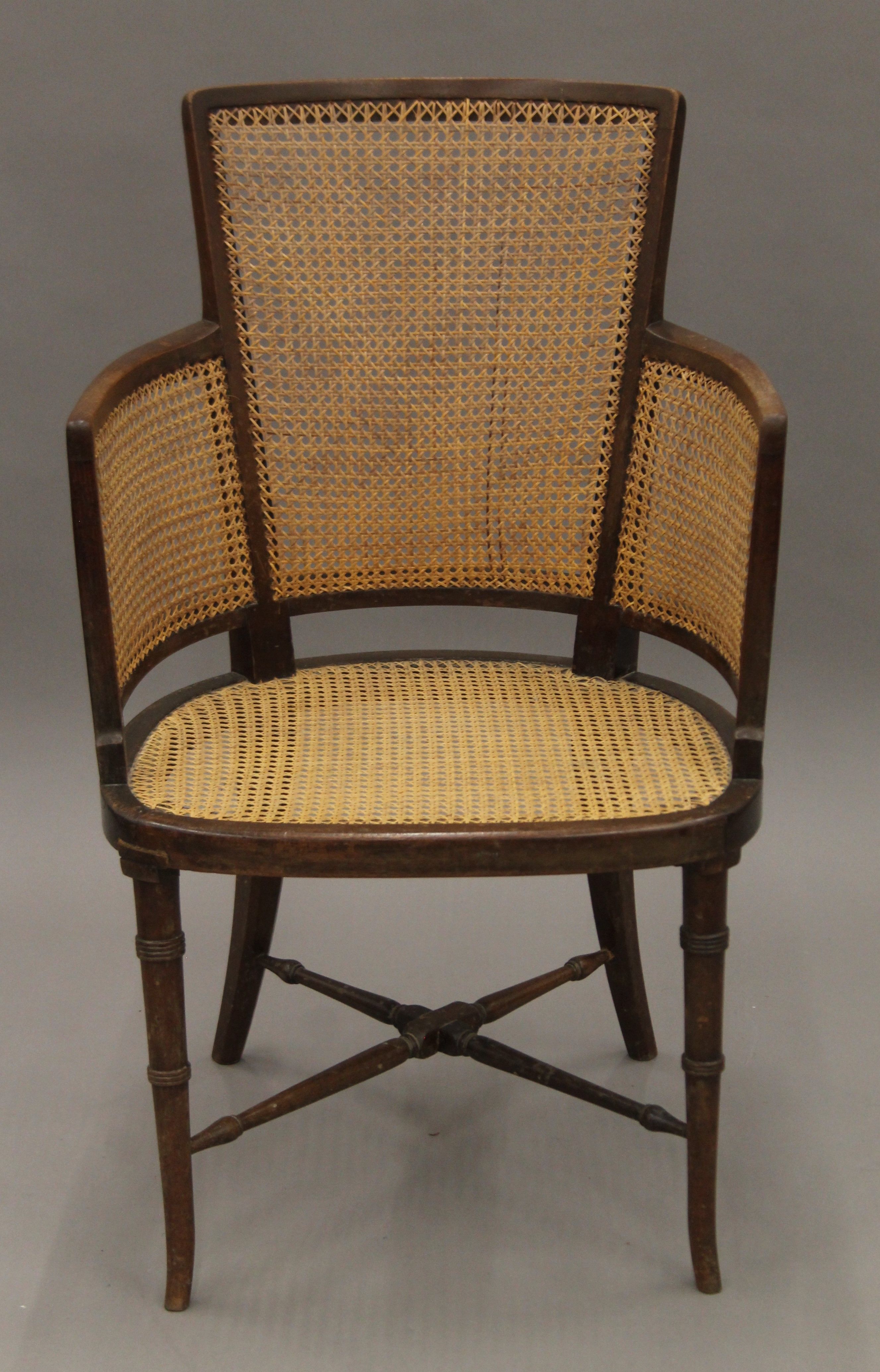 An early 20th century bergere chair. 54 cm wide.