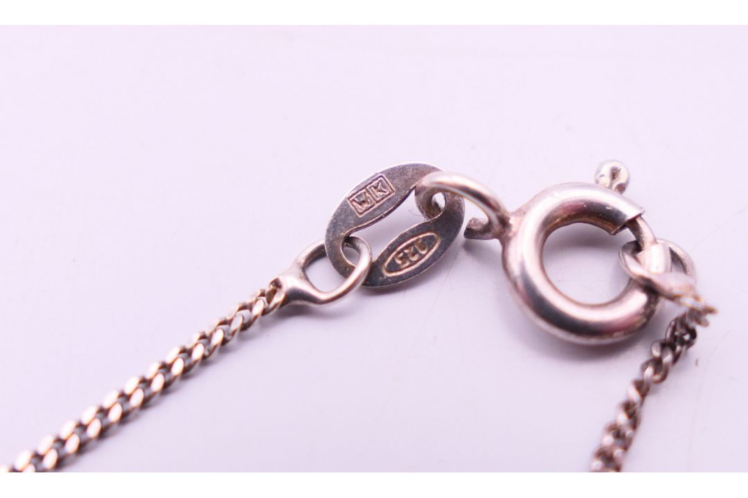 A silver and amber pendant on a silver chain. Pendant 3.5 cm high, chain 41 cm long. - Image 6 of 7