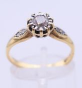 An 18 ct gold diamond ring. 3.3 grammes total weight. Ring size N/O.
