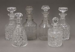 Six cut crystal glass decanters, etc. The largest 27 cm high.