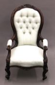A Victorian blue upholstered mahogany open armchair. 64 cm wide.