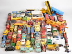 Over fifty vintage Dinky and Corgi diecast model cars to include FAB1, Mercedes Benz 600, Esso