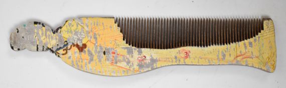 Chinese wooden comb in the form of a Geisha, 17cm long.