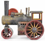 Likely Bing German made live steam roller in maroon, yellow and black with flywheel and burner,