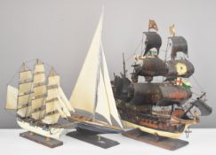 Three various model boats or ships, comprising a galleon, clipper or similar sailing ship and a