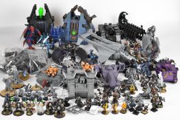 A large collection of Games Workshop Warhammer and Warhammer 40k miniatures and vehicles to