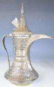 Middle Eastern Omani or similar silver Dallah with all over embossed decoration, 31cm tall, 542g.