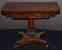 Victorian flame mahogany fold over card table with rectangular top, raised on a tapering column