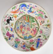 Chinese 19thC famille rose shallow dish with figural, animal and dragon decoration, 30cm in