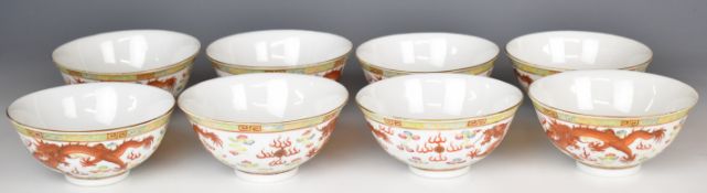 A set of eight Chinese porcelain bowls, each with dragon decoration and six character Yongzheng mark