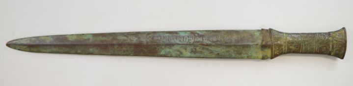 Chinese bronze dagger with script to the double edged blade and ornate decoration to the handle,