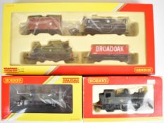 Three Hornby 00 gauge model railway tank locomotives comprising two BR 14xx and a Railroad GWR